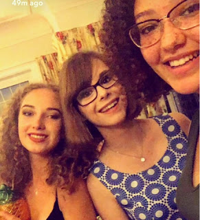 Chloe and two friends smiling at the camera