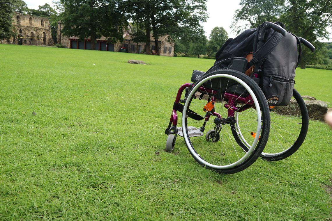 Purple wheelchair on grass